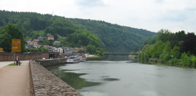 mettlach germany with the river flowing between the valley walls and pleasure craft in the water